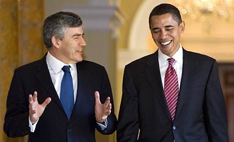 British Prime Minister Gordon Brown shares a joke with Senator Barack Obama