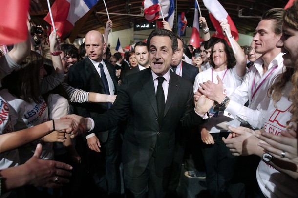 Nicolas Sarkozy shakes hands with supporters