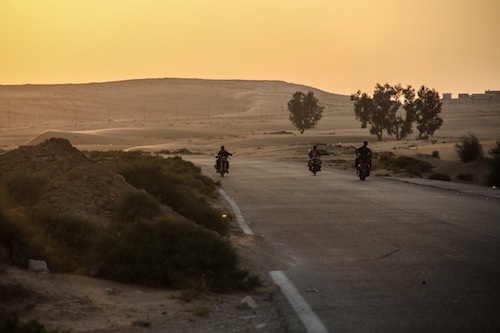 Bedouins drive on bikes in the temperate area of Jabal Al Halal in Northern Sinai close to the borders with Israel and a hotbed of outlaws. 