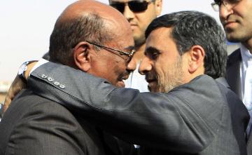 Iranian President Mahmoud Ahmadinejad hugs Sudan’s President Omar Hassan al-Bashir