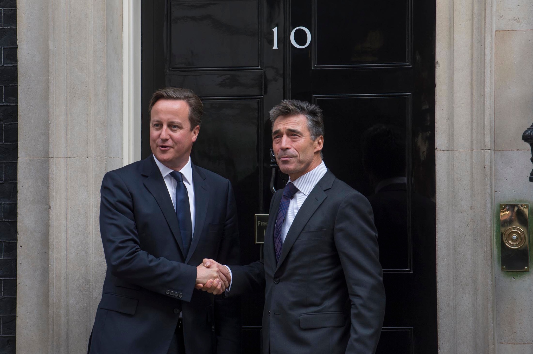 UK Prime Minister David Cameron greets NATO Secretary General Anders Fogh Rasmussen, Sept. 18, 2013