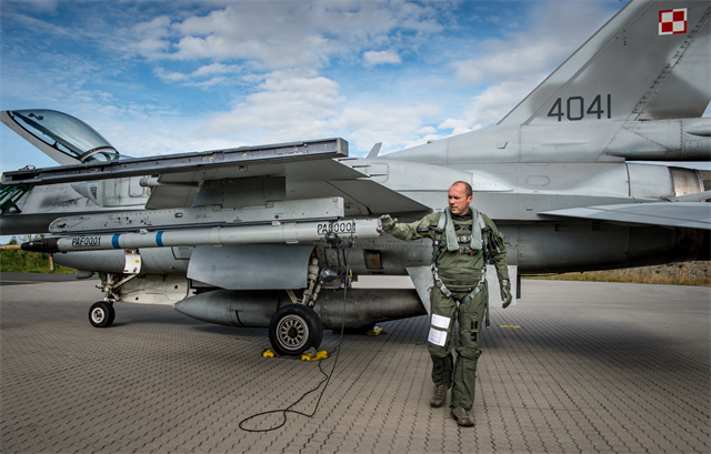 LTC POL AF Paul does his F-16 walkaround inspection before flight in Exercise Brilliant Arrow