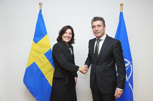Swedish Defense Minister Karin Enstrom and NATO Secretary General Anders Fogh Rasmussen