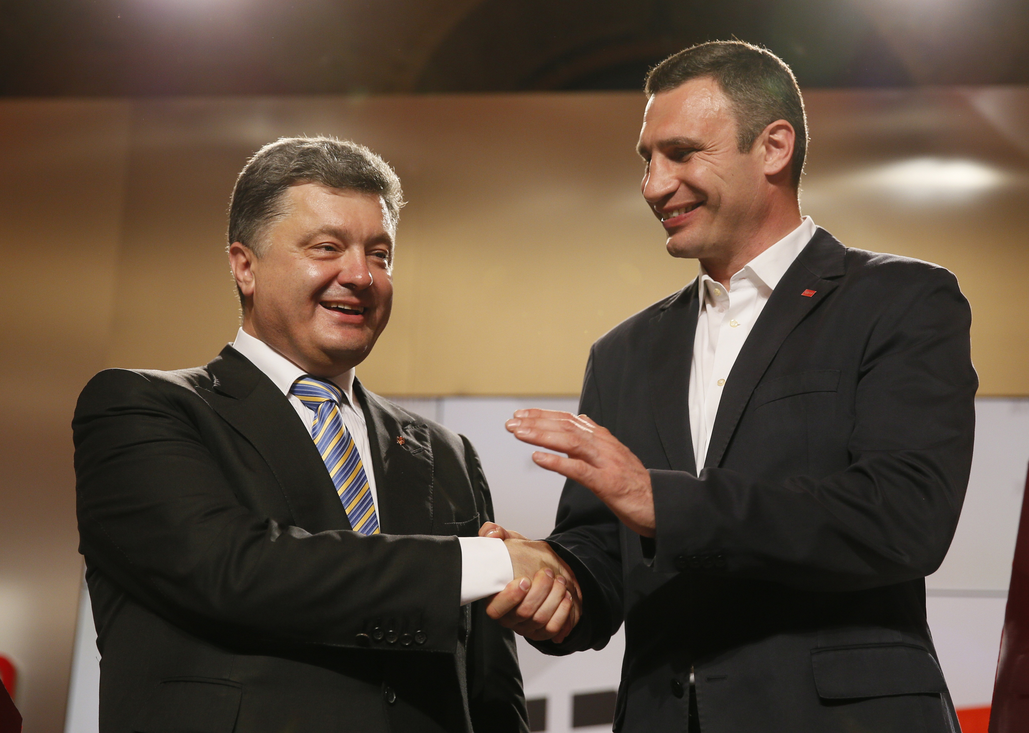 Presidential candidate Petro Poroshenko (left) and Kyiv mayoral candidate Vitali Klitschko celebrate after claiming victory in the May 25 elections. Klitschko withdrew from the presidential race and allied his UDAR party (the Ukrainian Democratic Alliance for Reform) with Poroshenko’s candidacy. Both men are seen as centrists. REUTERS/Gleb Garanich 