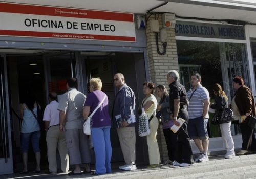 People enter a government job centre in Madrid June 2, 2009.