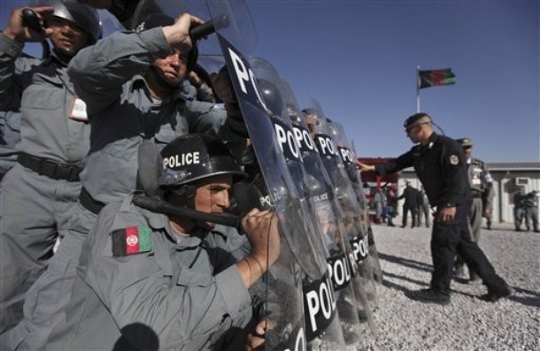 Afghans Purge Hundreds of Top Cops as NATO Cheers