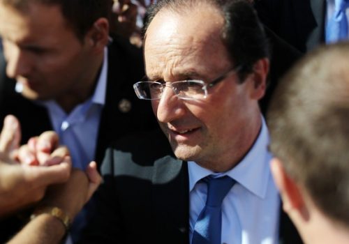Francois Hollande shakes supporters hands