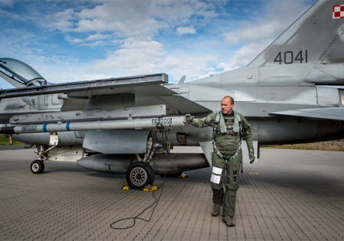 LTC POL AF Paul does his F-16 walkaround inspection before flight in Exercise Brilliant Arrow