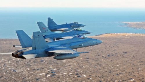 A Swedish JAS 39 Gripen, Norwegian F-16, and Finnish F/A-18 Hornet participating in Iceland Air Meet 2014