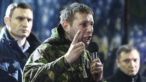 At Kyiv’s Maidan Nezalezhnosti (Independence Square) mass demonstration, Volodymyr Parasiuk denounces a compromise deal signed by Vitaly Klitschko (left) and other opposition party leaders to let then-President Viktor Yanukovych stay in office. February 21, 2014 - REUTERS/Vitaliy Nosach