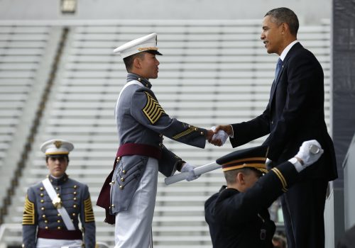 President Barack Obama hands a diploma to one of about 1,000 graduating cadets at the U.S. Military Academy at West Point, New York, on May 28. Obama’s commencement address is one of several the White House plans to lay out his foreign policy vision for the remainder of his term in office. REUTERS/Kevin Lamarque