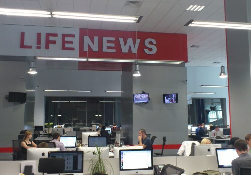 Journalists work in the newsrom at Russia's LIfe News TV channel. (CC License)