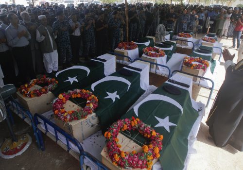 Relatives and colleagues of Airport Security Force soldiers killed on Sunday's Taliban attack on Jinnah International Airport, offer funeral prayers on June 9. Militant fighters stormed the airport disguised as security forces. REUTERS/Athar Hussain
