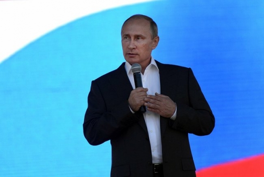 Putin Says Russia Will Keep Building Military Power