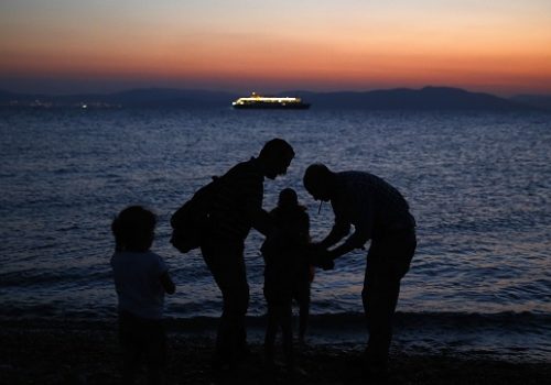 Photo: Syrian refugees arrive at the Greek island of Kos on a dinghy. Picture taken 12 Aug, 2015. Reuters/Yannis Behrakis