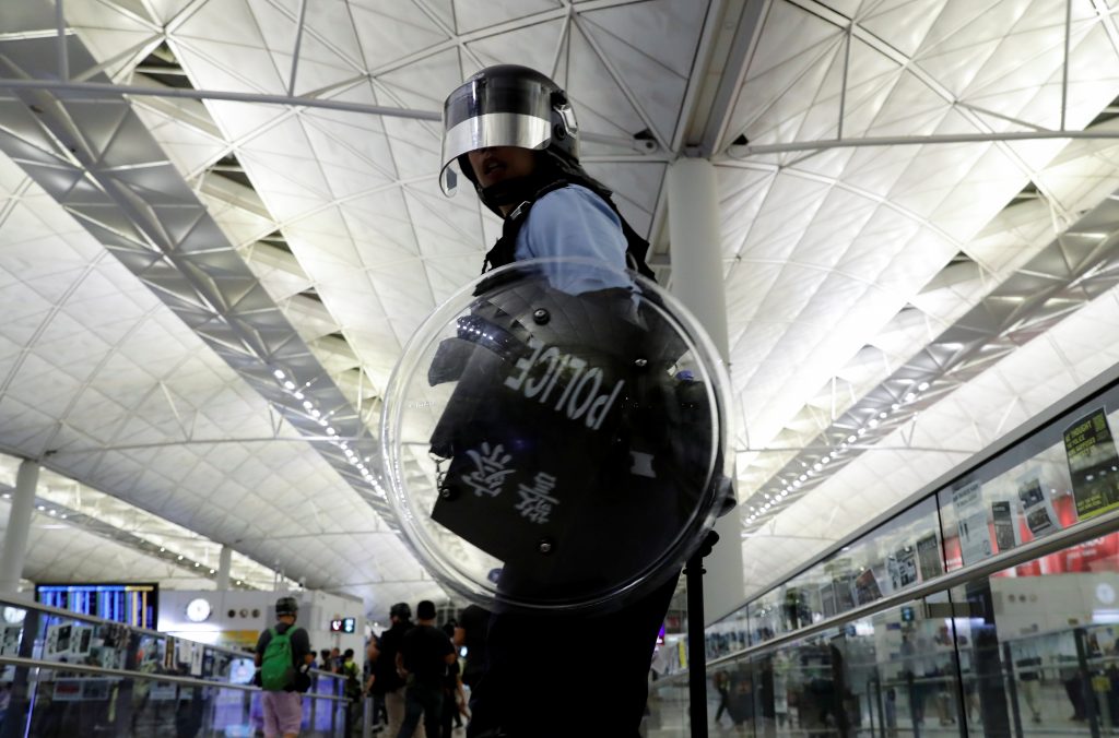 Airport clash raises fear of violent crackdown in Hong Kong