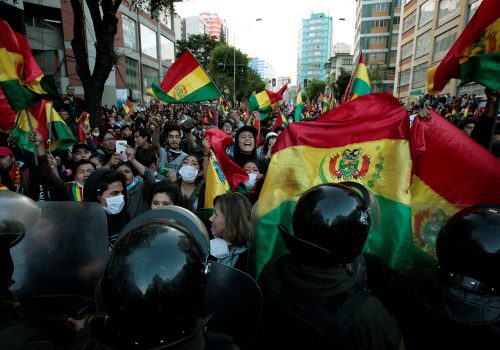 A tale of two flags: How Bolivia’s racial divide is shaping its political crisis