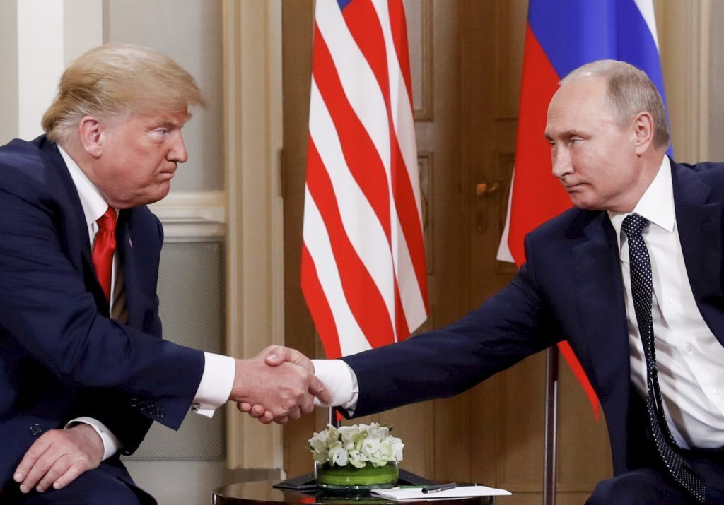 U.S. President Donald Trump and Russia’s President Vladimir Putin shake hands as they meet in Helsinki, Finland July 16, 2018. 