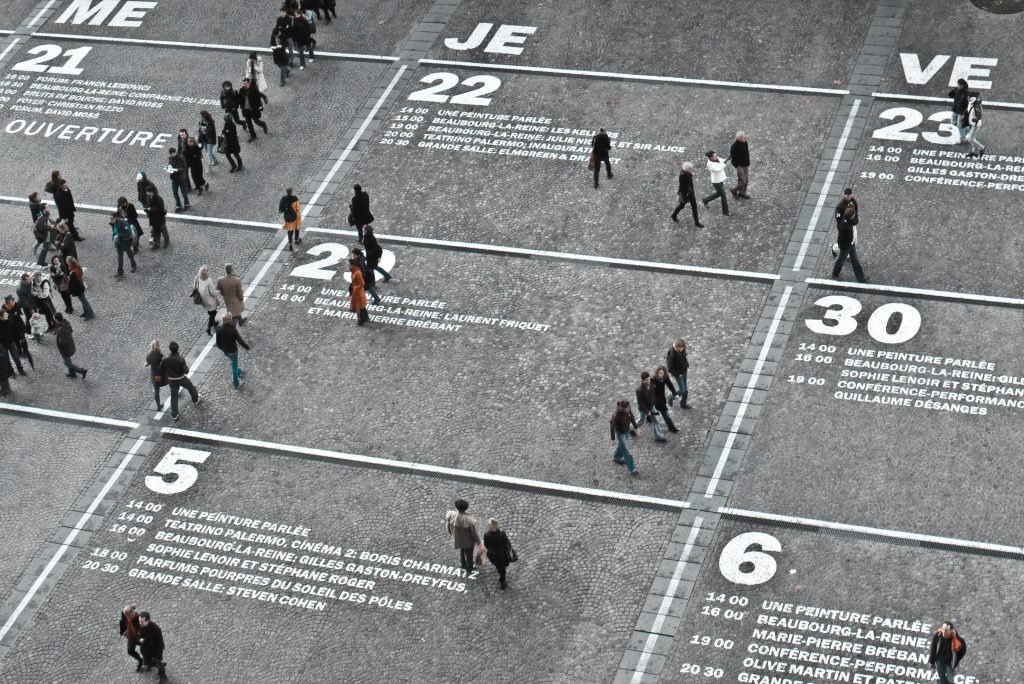 people walking on a road that looks like a calendar during day time