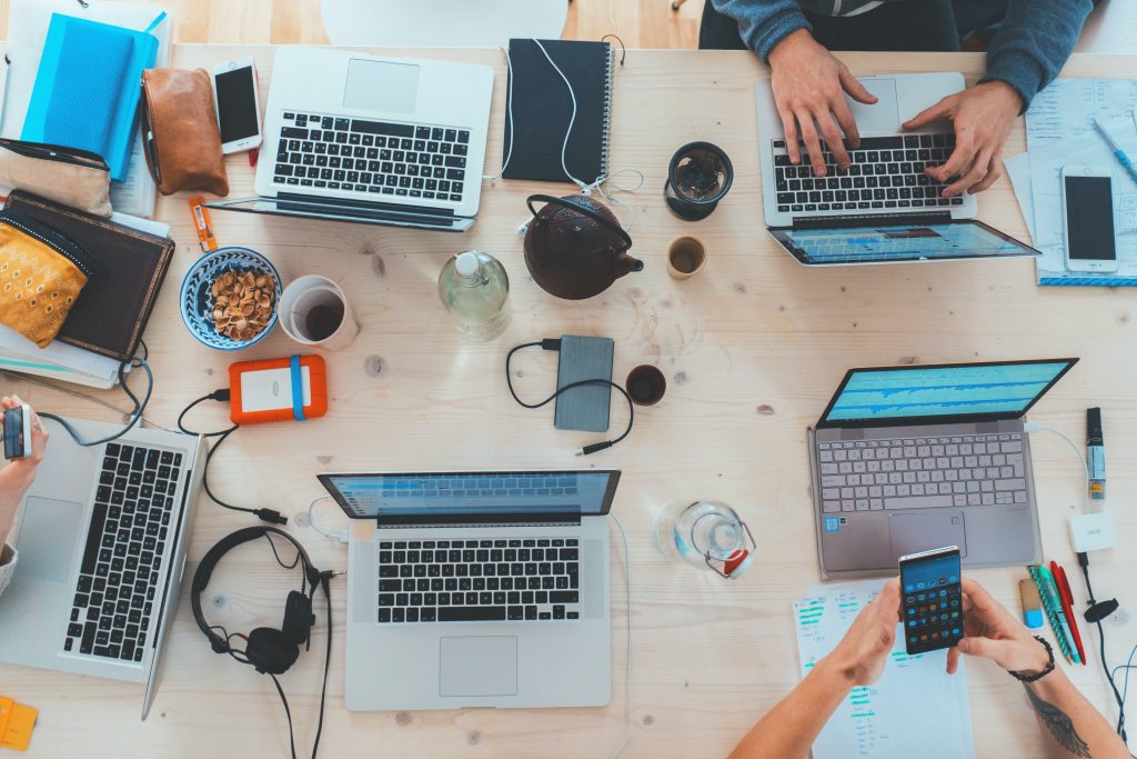 gtc people at work with computers at a table together