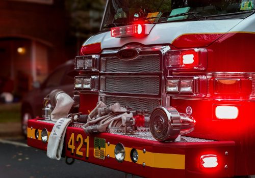 gtc front of a fire engine with the lights glowing