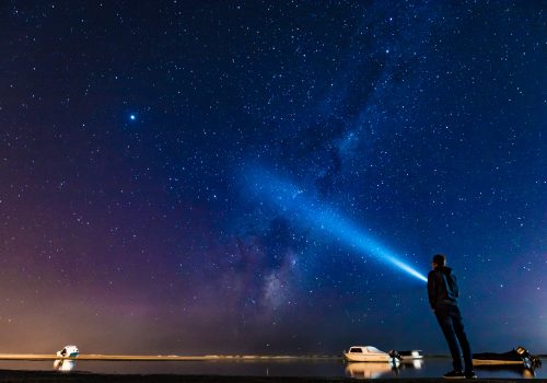 gtc searchlight shining into the night sky
