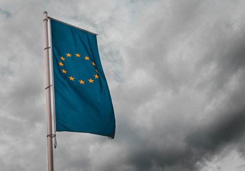 EU flag flying under a cloud sky in Germany