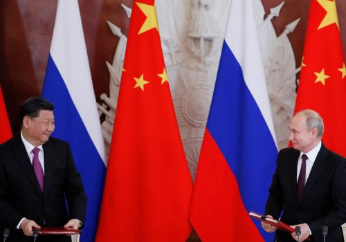 President of Russia Vladimir Putin and President of China Xi Jinping look on during a signing ceremony.