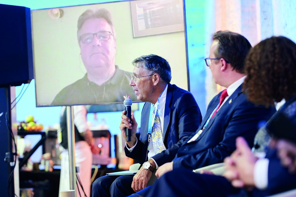 People speaking on a panel