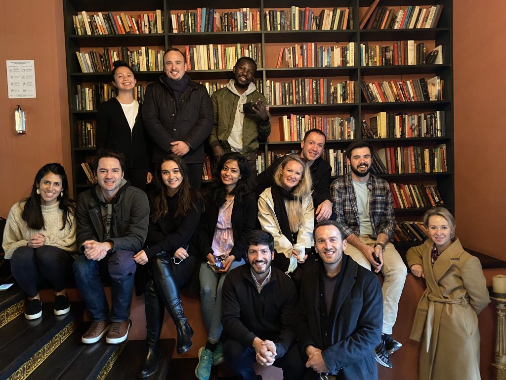 Group of people smiling in a library