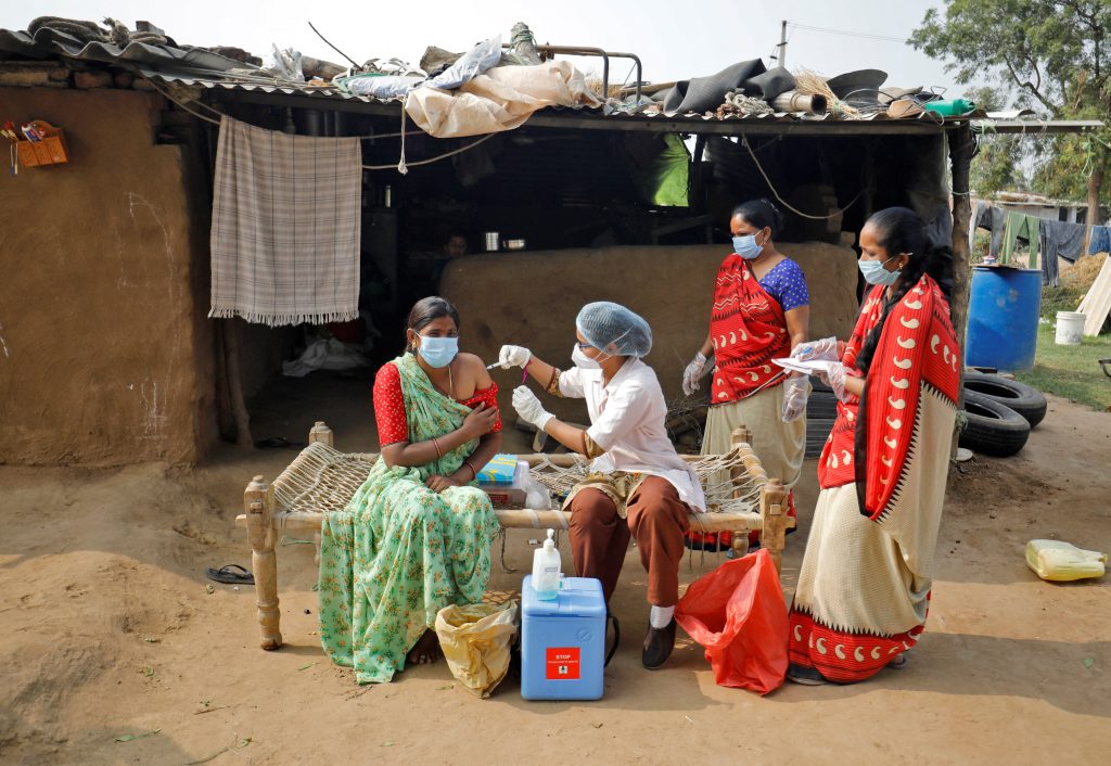 Woman in India receiving the COVID-19 vaccine