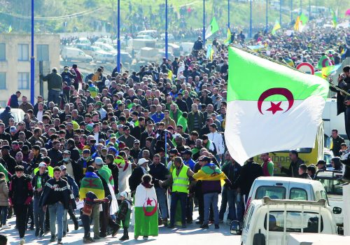 Demonstrators carrying flags