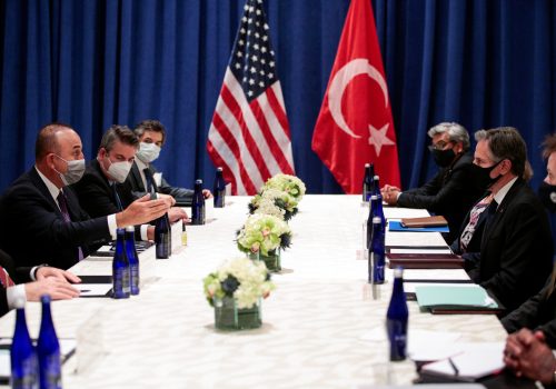 Diplomatic men sitting around a table in discussion