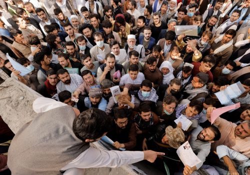 Mass of Afghan people standing in a crowd