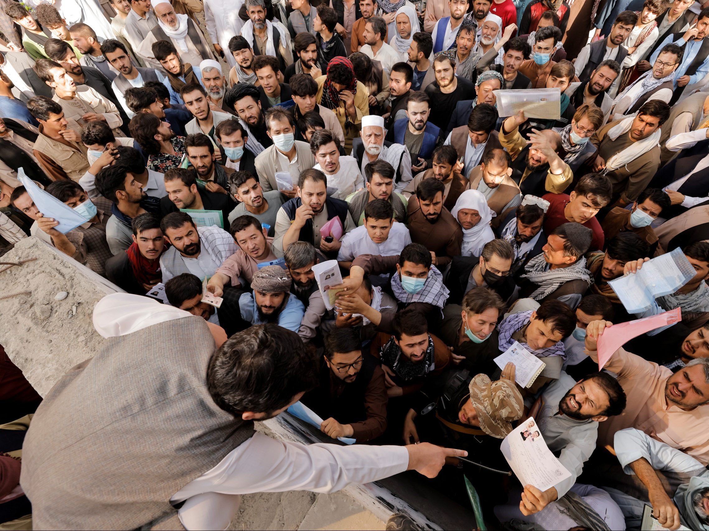 Mass of Afghan people standing in a crowd