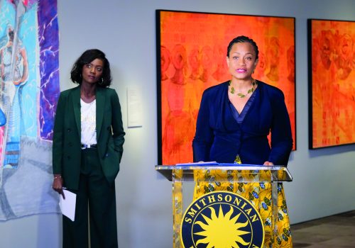 two women behind a podium