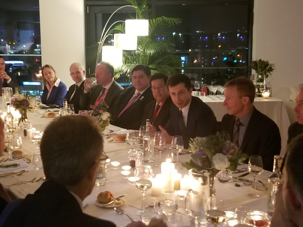 people sitting at a candlelight dinner table