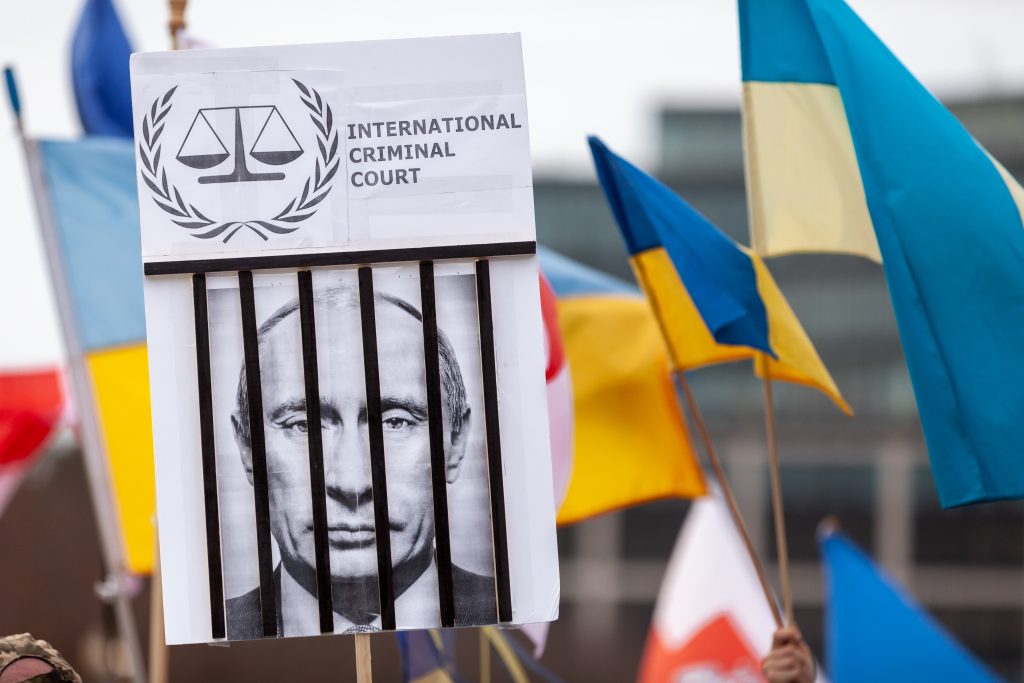 Experts react: The International Criminal Court just issued an arrest warrant for Putin. Will he wind up behind bars? 