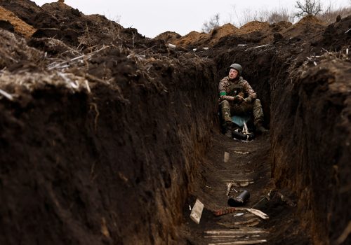 A Ukrainian soldier of the Paratroopers' of 80th brigade listens to artillery fire a frontline position near Bakhmut, amid Russia's attack on Ukraine, in Donetsk region, Ukraine March 16, 2023. REUTERS/Violeta Santos Moura