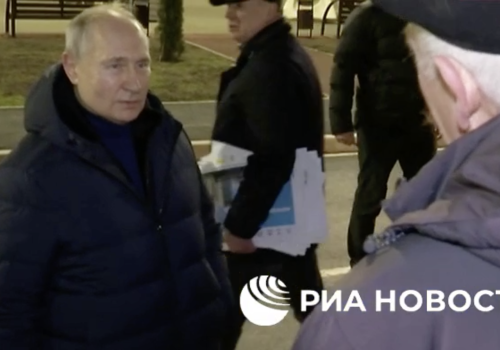 Footage published by RIA Novosti shows Vladmir Putin’s entourage reacting after a woman reportedly yelled “This all is not true! It’s all for a show!” The clip was later edited out by the Kremlin.