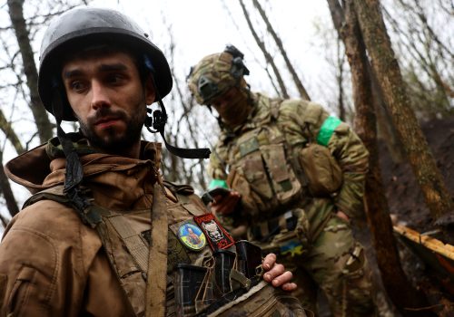 A Ukrainian artillery unit operates from muddy trenches near the frontline during heavy fighting close to Bakhmut, Ukraine, April 13, 2023. (Source: Reuters/Kai Pfaffenbach)