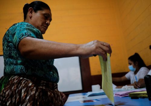A woman casts her vote at a polling station during the first round of Guatemala's presidential election in Chinautla, Guatemala, June 25, 2023.