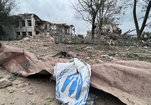 A damaged canvas sign featuring the logo for the United Nations High Commissioner for Refugees (UNCHR) appears among the ruins of an attack on an aid station in Zaporizhzhia Oblast, Ukraine. (Source: zoda_gov_ua/archive)