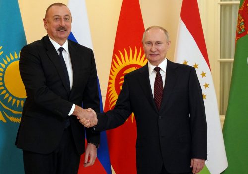 Russian President Vladimir Putin shakes hands with Azeri President Ilham Aliyev ahead of a meeting of the Commonwealth of Independent States (CIS) leaders in Saint Petersburg, Russia, December 26, 2022.