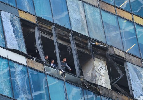 Members of security services investigate a damaged office building in the Moscow City following a reported Ukrainian drone attack in Moscow Russia, August 1, 2023. REUTERS/Evgenia Novozhenina