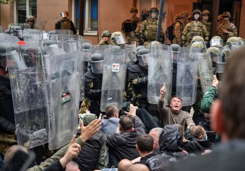 Local Kosovo Serb protesters sit on the ground in front of NATO Kosovo Force (KFOR) soldiers in the town of Zvecan, Kosovo, May 29, 2023. REUTERS/Laura Hasani