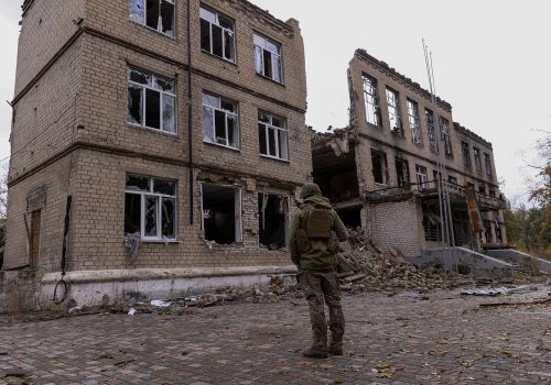 FILE PHOTO: A police officer stands in front of a damaged building, amid Russia's attack on Ukraine, in the town of Avdiivka, Donetsk region, Ukraine October 17, 2023. REUTERS/Yevhen Titov/File Photo