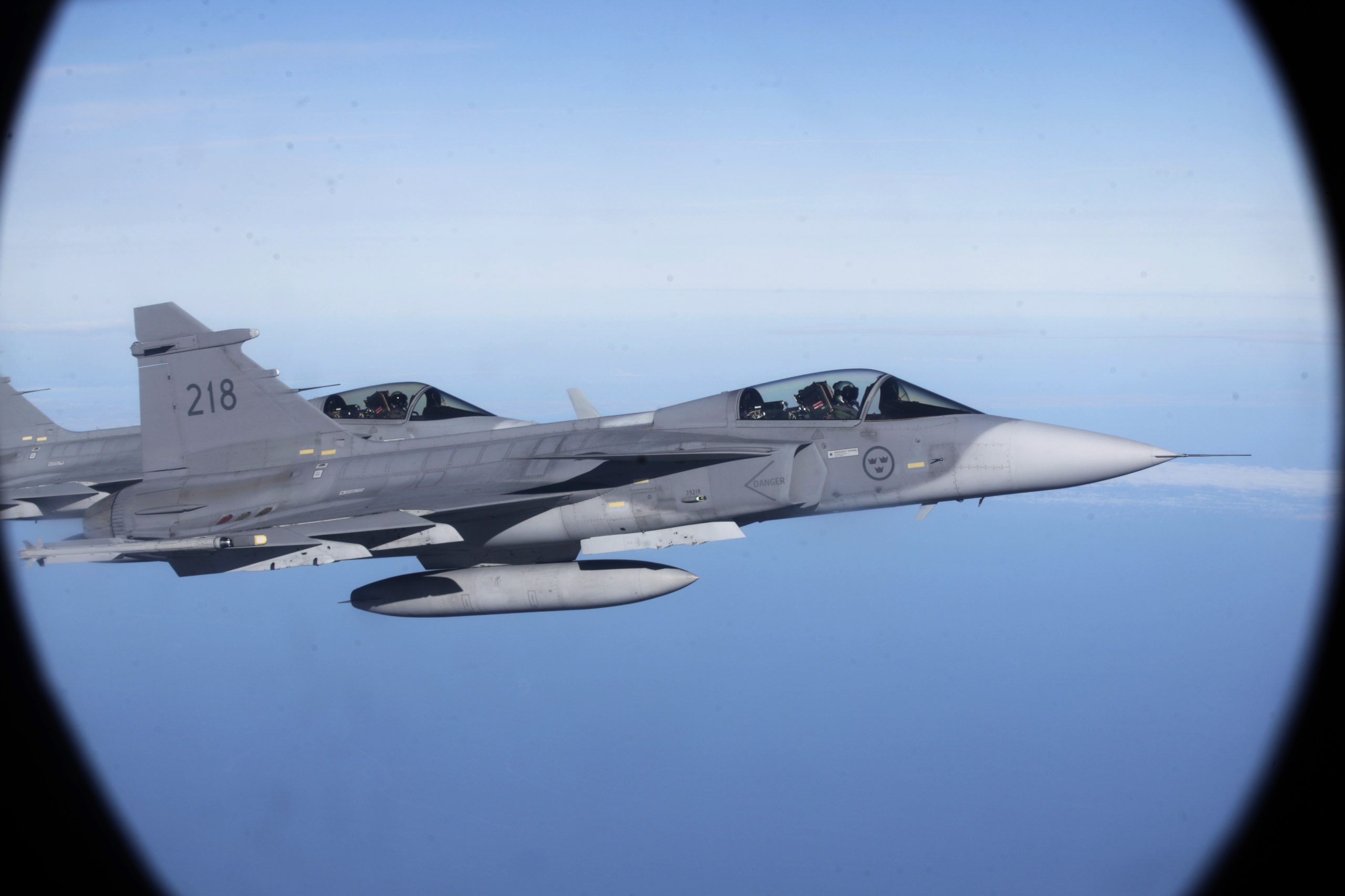 Sweden’s Air Force “Grippen” fighters are seen as they escort a Lithuania’s Air Force C-27J plane during NATO joint military exercise in Siauliai April 1, 2014. REUTERS/Ints Kalnins