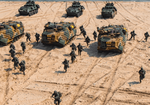 Republic of Korea Marines storm onto beach during a simulated amphibious assault