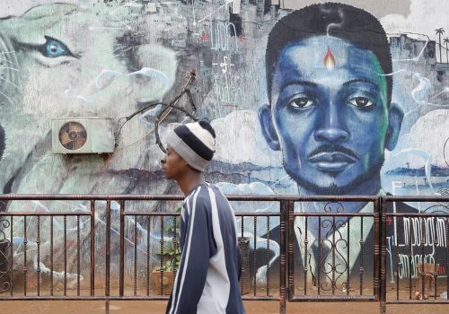 A man walks past a graffiti of Ugandan opposition presidential candidate Bobi Wine in Kampala, Uganda, January 17, 2021. (Source: REUTERS/Baz Ratner)